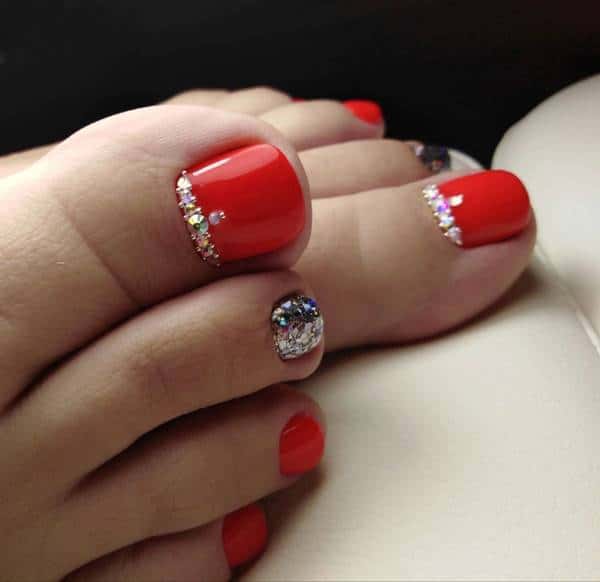 umas pedicure design vermelho com pedras 3d 